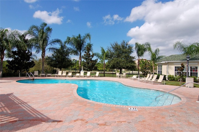 view of swimming pool featuring a patio