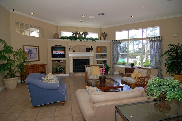 living room with ornamental molding, a fireplace, and light tile patterned floors