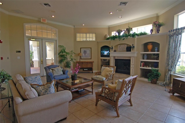 tiled living room featuring ornamental molding, french doors, and a healthy amount of sunlight