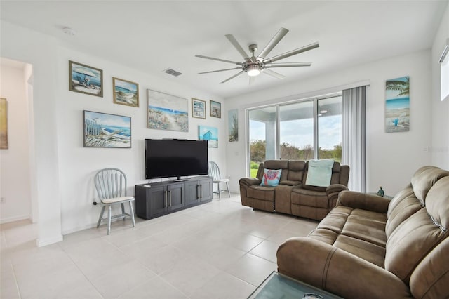 tiled living room with ceiling fan