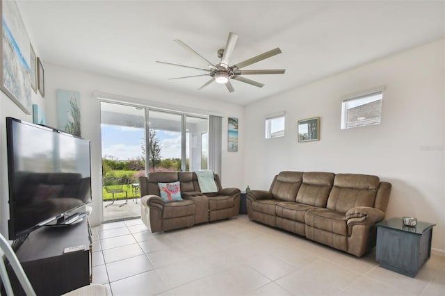 tiled living room with ceiling fan