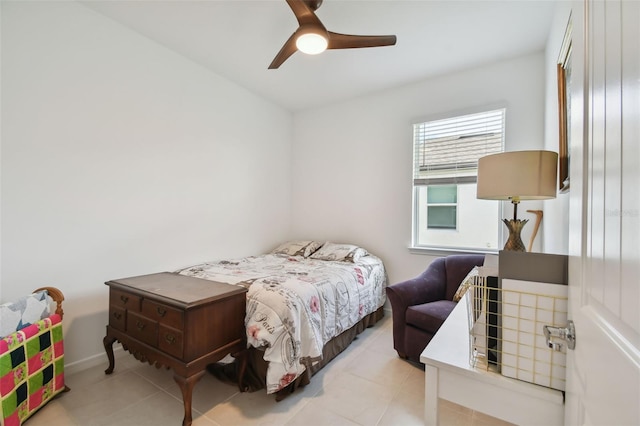 bedroom featuring light tile patterned flooring and ceiling fan