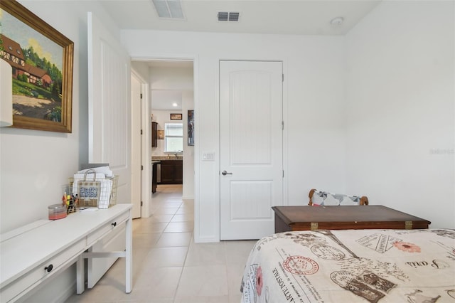 bedroom with light tile patterned flooring