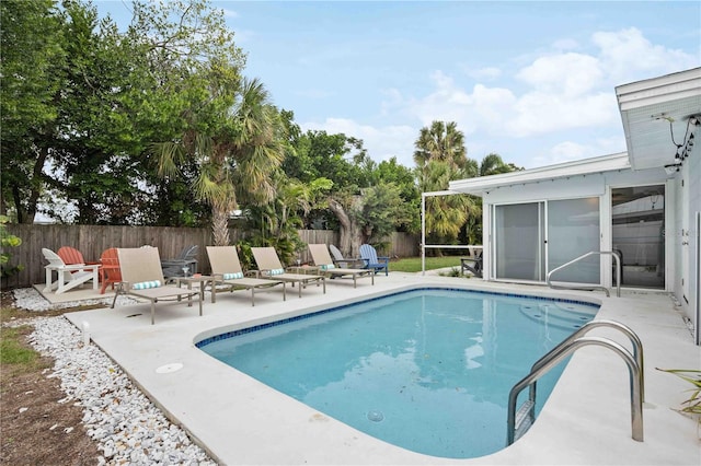 view of swimming pool featuring a patio area