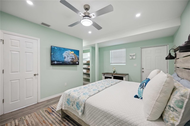 bedroom featuring wood-type flooring and ceiling fan