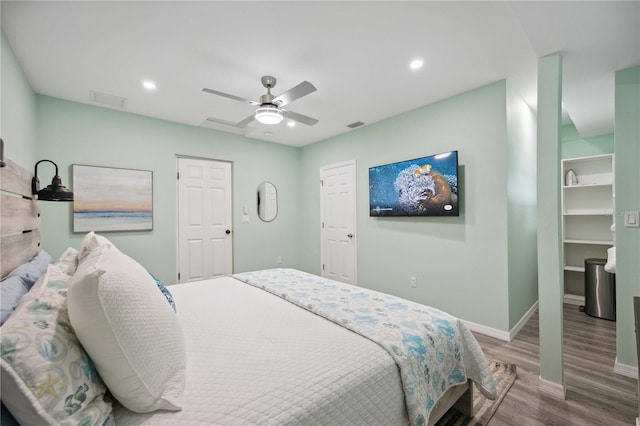 bedroom featuring ceiling fan and hardwood / wood-style flooring