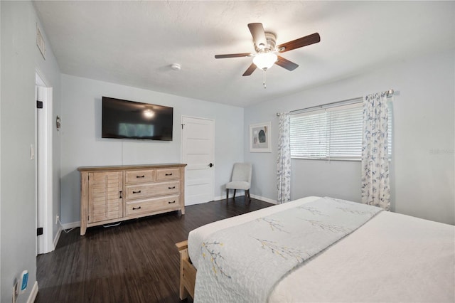 bedroom with dark wood-type flooring and ceiling fan