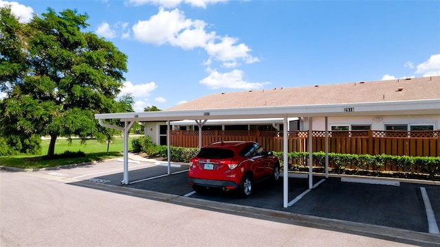 covered parking lot with fence