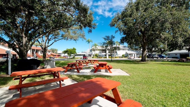 view of property's community featuring a yard