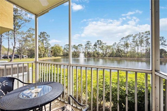 unfurnished sunroom with a water view