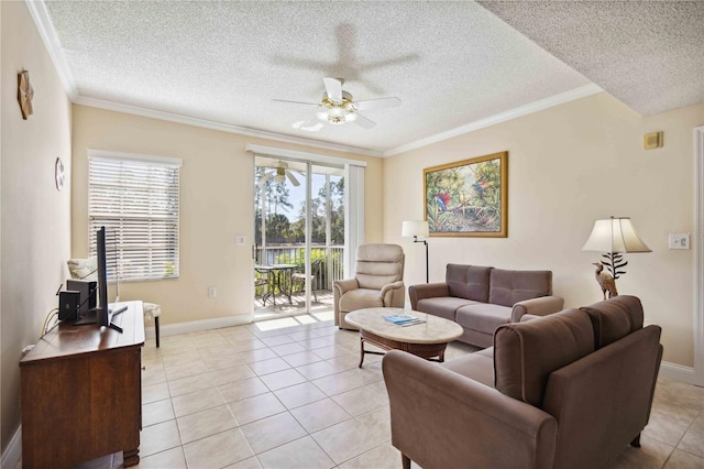 living area featuring ornamental molding, light tile patterned flooring, a ceiling fan, and a healthy amount of sunlight