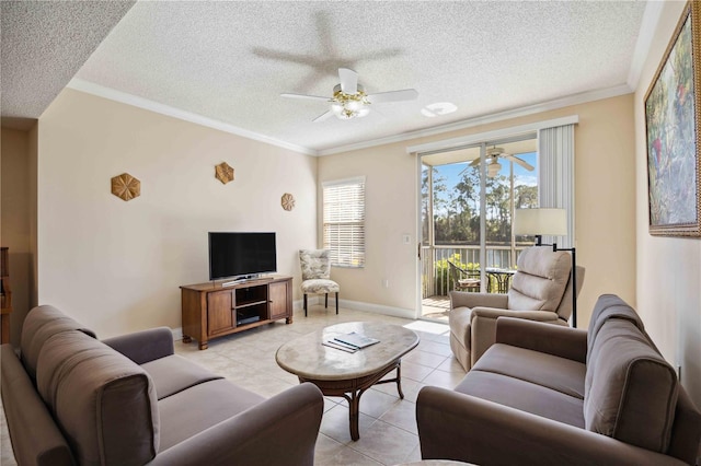 living area featuring crown molding, light tile patterned floors, ceiling fan, a textured ceiling, and baseboards