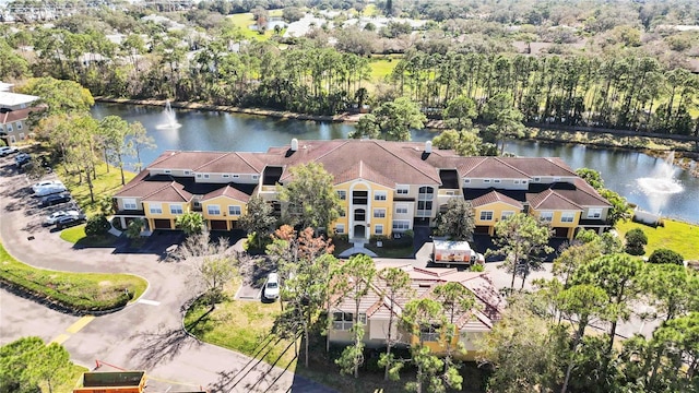 bird's eye view featuring a residential view and a water view