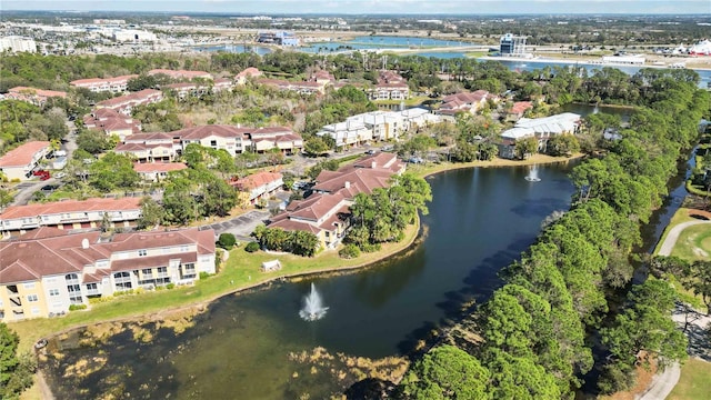 drone / aerial view with a residential view and a water view