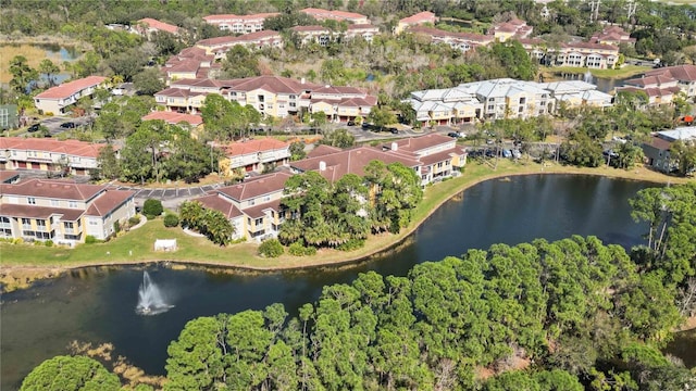 drone / aerial view featuring a water view and a residential view