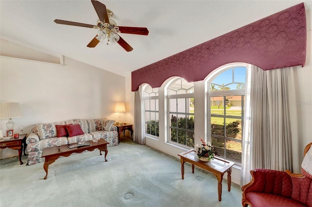 living room with light carpet, lofted ceiling, and ceiling fan