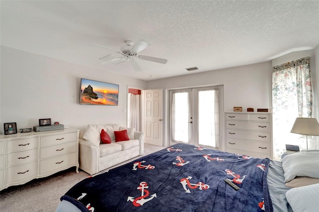 bedroom with french doors, light carpet, a textured ceiling, and ceiling fan