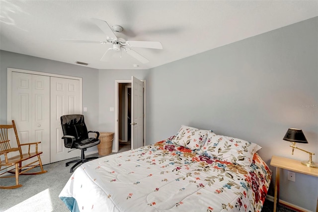 carpeted bedroom featuring a closet and ceiling fan