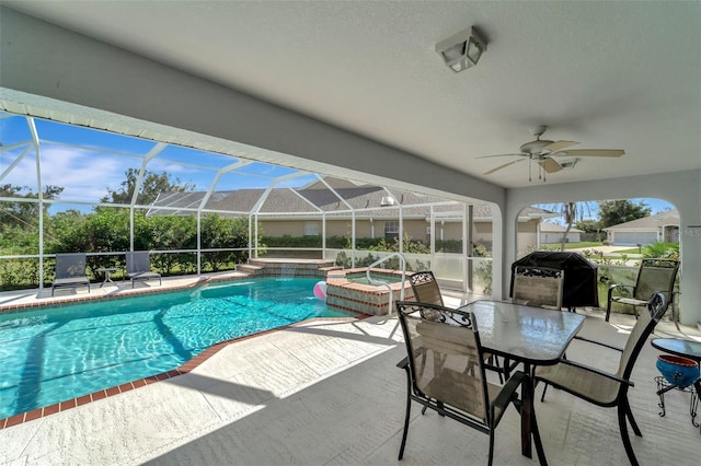 view of swimming pool with grilling area, an in ground hot tub, a lanai, a patio area, and ceiling fan