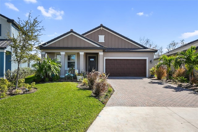 view of front facade with a front lawn and a garage