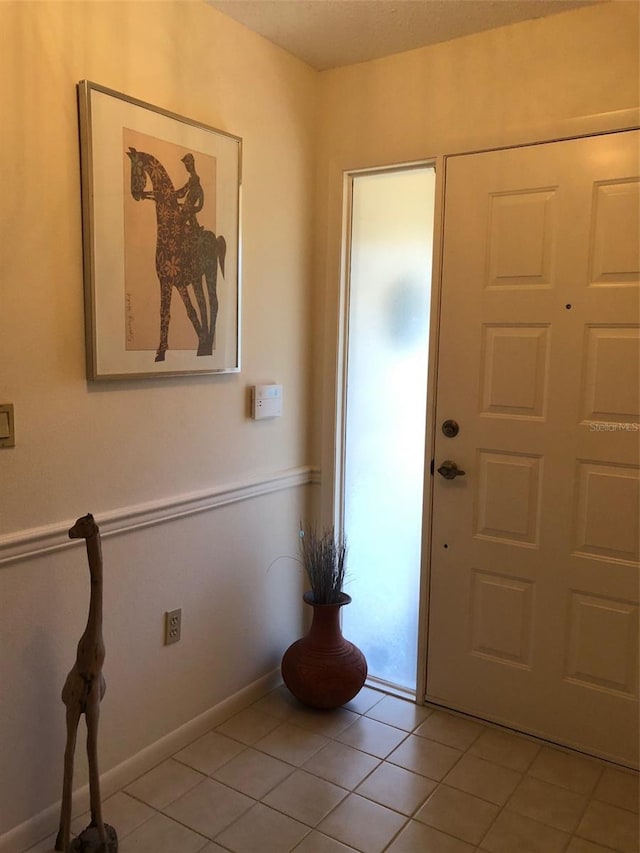 entryway featuring light tile patterned floors