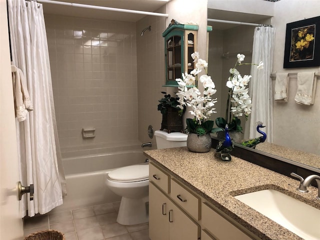 full bathroom with tile patterned floors, vanity, shower / tub combo, and toilet