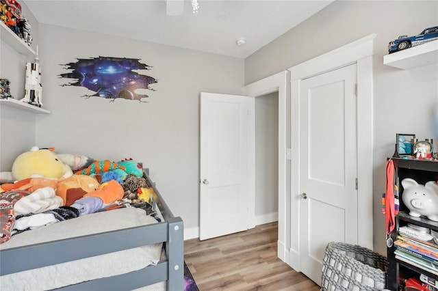 bedroom with hardwood / wood-style flooring