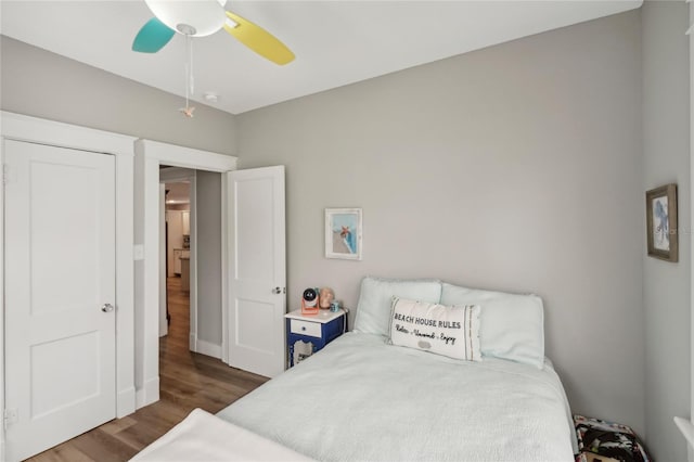 bedroom featuring dark hardwood / wood-style floors and ceiling fan