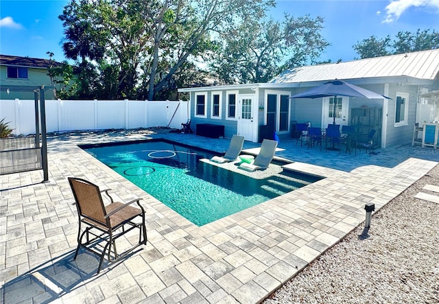 view of swimming pool with a patio