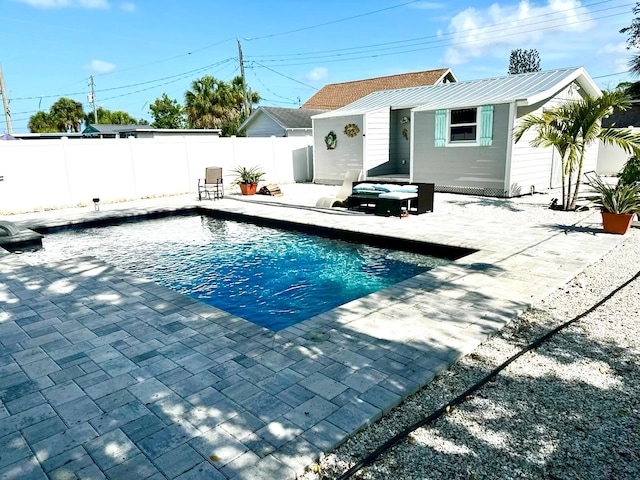 view of swimming pool featuring a patio