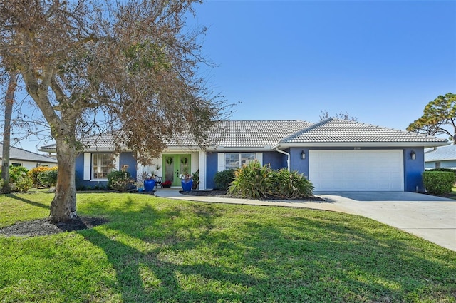 ranch-style home featuring a front lawn and a garage