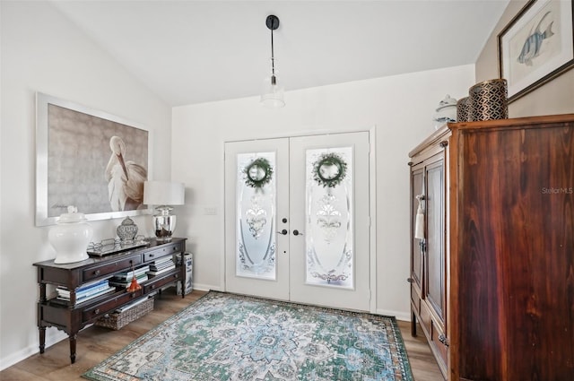 218 Brandywine Cir, Englewood, FL 34223 - entryway with french doors, light wood finished floors, and lofted ceiling