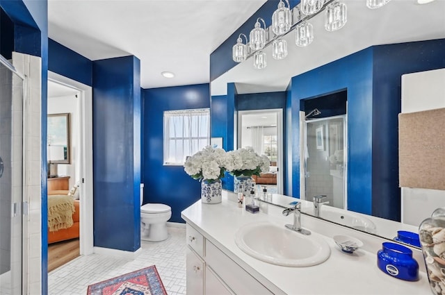 bathroom featuring vanity, toilet, tile patterned floors, and an enclosed shower