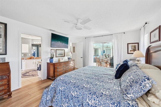 bedroom with connected bathroom, access to outside, light hardwood / wood-style flooring, a textured ceiling, and ceiling fan