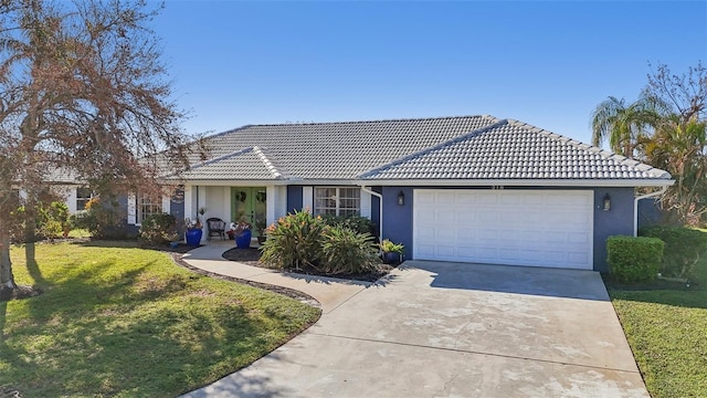 218 Brandywine Cir, Englewood, FL 34223 - single story home featuring an attached garage, a tile roof, a front yard, and concrete driveway
