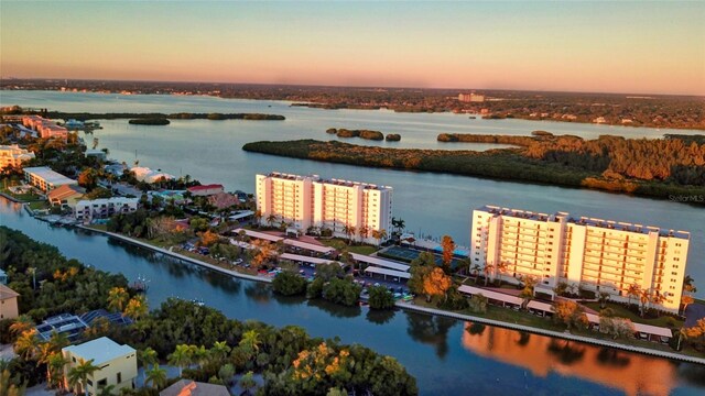 aerial view at dusk with a water view