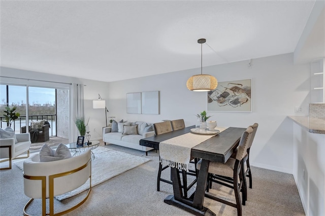 dining room featuring light carpet