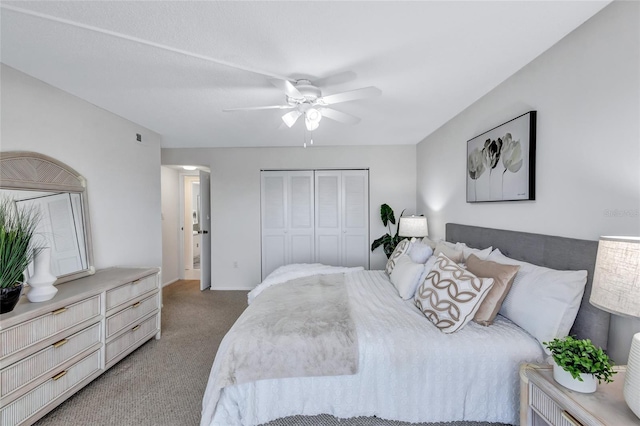 bedroom with a closet, carpet flooring, and ceiling fan