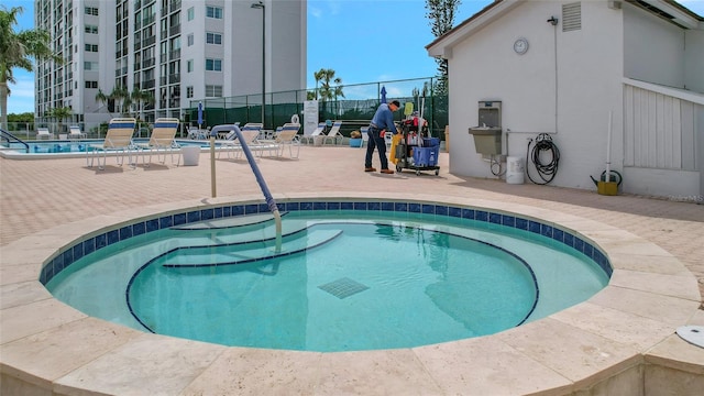 view of swimming pool featuring a patio