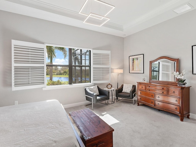 bedroom with light carpet, crown molding, and a water view