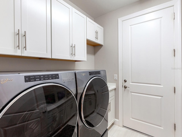 laundry room with cabinets and independent washer and dryer