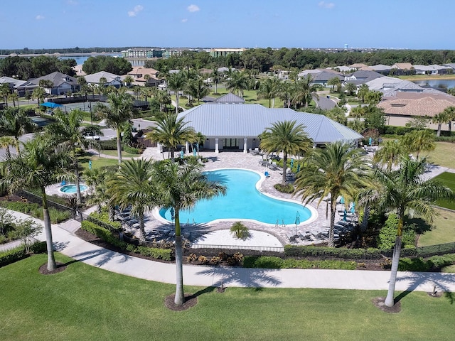 view of pool with a yard and a patio