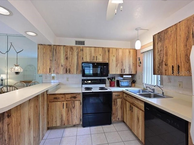 kitchen with decorative backsplash, sink, black appliances, light tile patterned flooring, and decorative light fixtures