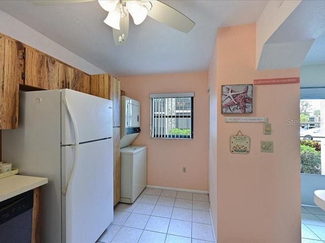 kitchen featuring white fridge, black dishwasher, plenty of natural light, and ceiling fan