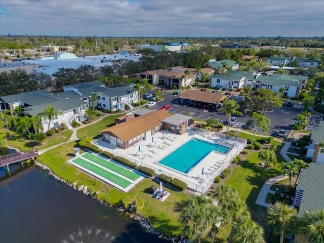 birds eye view of property with a water view