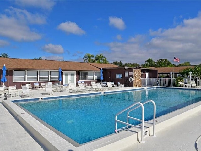 view of swimming pool with a patio area