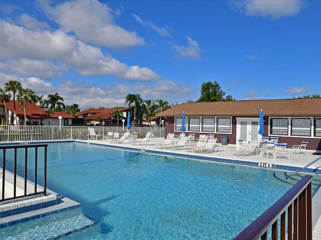 view of swimming pool featuring a patio area