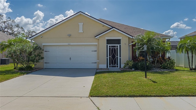 single story home featuring a front lawn and a garage