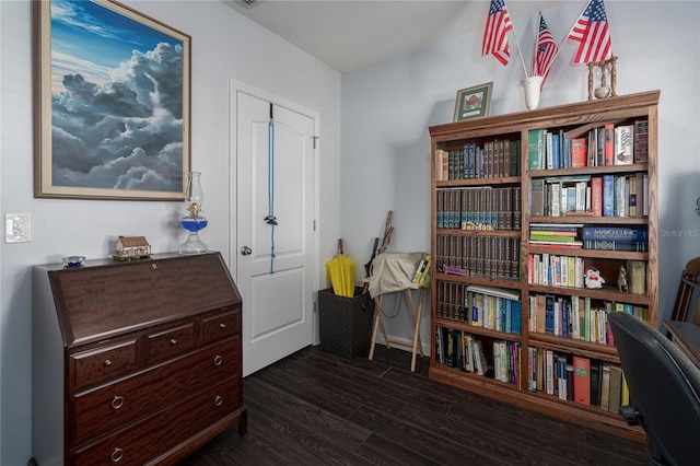 sitting room with dark wood-type flooring