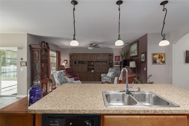 kitchen featuring a healthy amount of sunlight, sink, pendant lighting, and ceiling fan